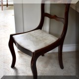 F44. Antique carved chair with upholstered seat. 